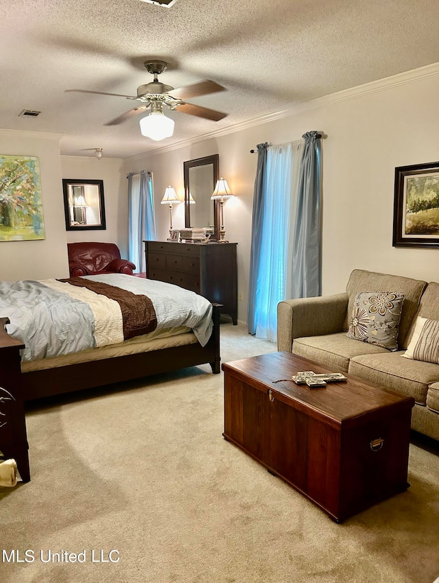 bedroom featuring light carpet, ornamental molding, a textured ceiling, and ceiling fan