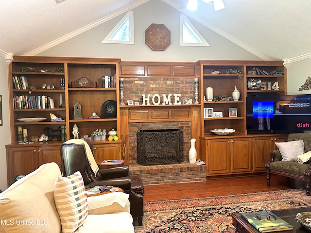 living room featuring ornamental molding, vaulted ceiling, a brick fireplace, and hardwood / wood-style floors