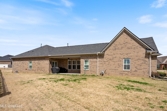 7327 Sunstone Dr, Olive Branch, MS 38654 - back of property featuring brick siding and a lawn
