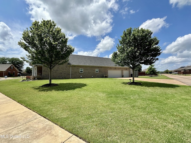7327 Sunstone Dr, Olive Branch, MS 38654 - view of front of house featuring an attached garage, concrete driveway, brick siding, and a front yard