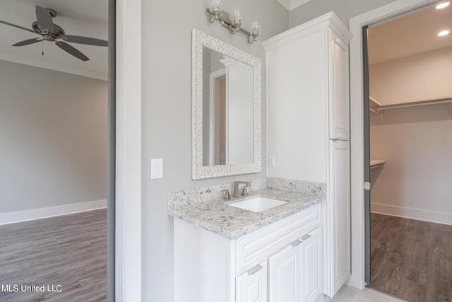 bathroom featuring vanity, ceiling fan, and hardwood / wood-style floors