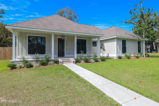 view of front of property with a front lawn and a porch