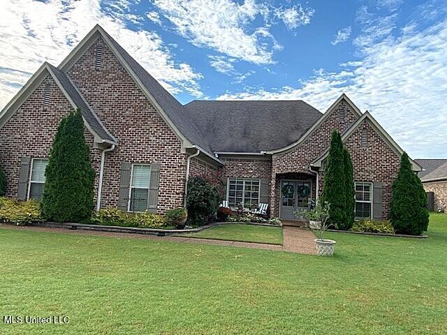 771 Robertson Way, Hernando, MS 38632 - view of front of home with brick siding and a front lawn