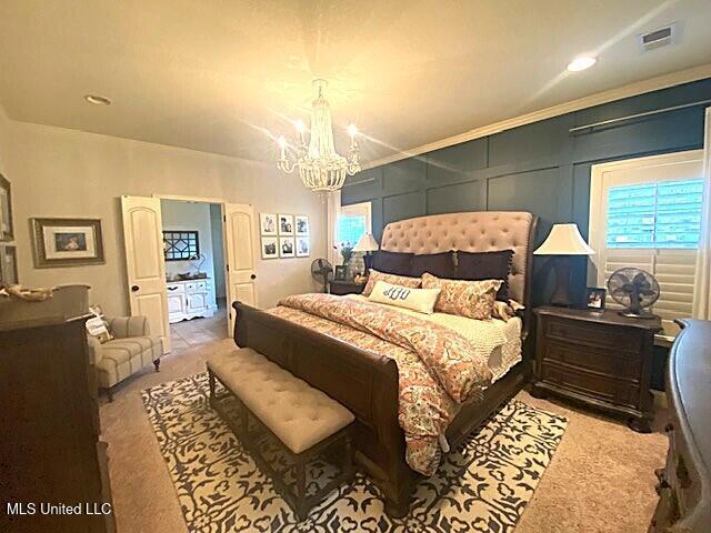 771 Robertson Way, Hernando, MS 38632 - carpeted bedroom featuring a chandelier, a decorative wall, and recessed lighting