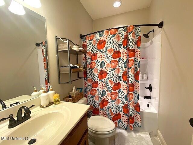 771 Robertson Way, Hernando, MS 38632 - bathroom with vanity and shower / bath combo with shower curtain
