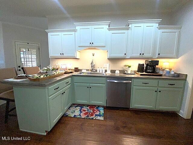 771 Robertson Way, Hernando, MS 38632 - kitchen with stainless steel dishwasher, dark wood-style floors, a breakfast bar, and white cabinetry
