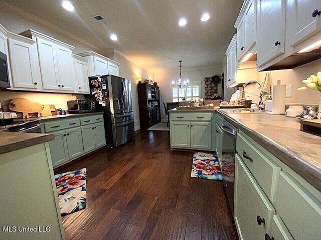 771 Robertson Way, Hernando, MS 38632 - kitchen with stainless steel appliances, a peninsula, recessed lighting, green cabinets, and dark wood-style flooring