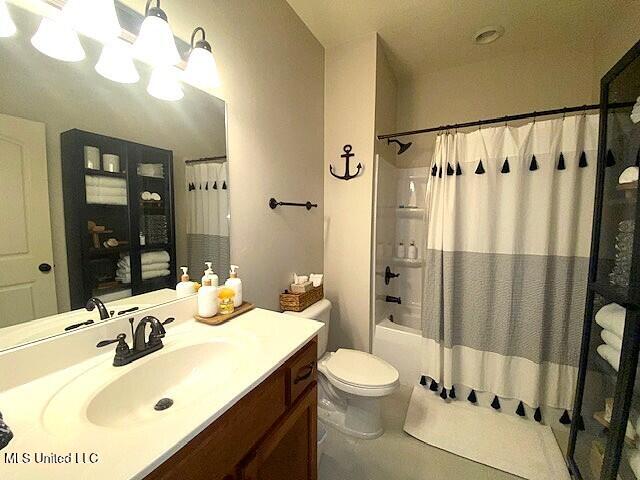 771 Robertson Way, Hernando, MS 38632 - bathroom with vanity, shower / tub combo with curtain, and a chandelier