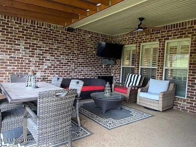 771 Robertson Way, Hernando, MS 38632 - view of patio featuring ceiling fan, an outdoor living space, and outdoor dining area