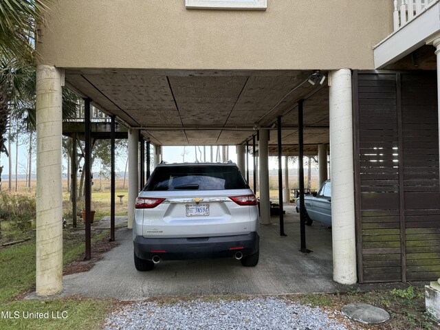 6301 Mary Mahoney Dr, Ocean Springs, MS 39564 - view of parking / parking lot with a carport