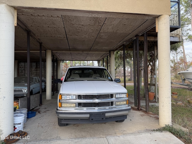 6301 Mary Mahoney Dr, Ocean Springs, MS 39564 - view of parking / parking lot featuring a carport