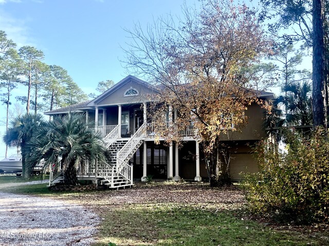 6301 Mary Mahoney Dr, Ocean Springs, MS 39564 - coastal home with covered porch and stairs
