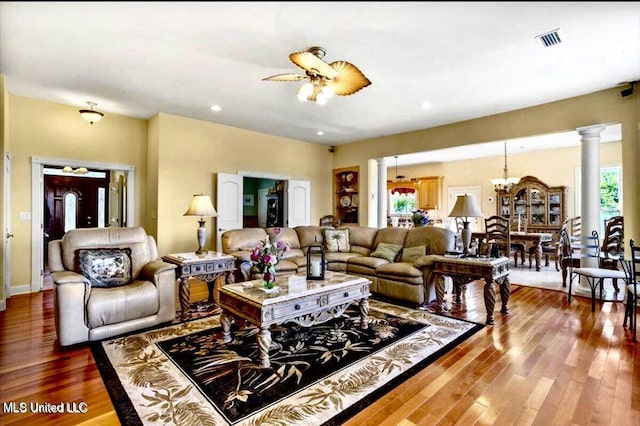 6301 Mary Mahoney Dr, Ocean Springs, MS 39564 - living room with wood finished floors, recessed lighting, a chandelier, and decorative columns