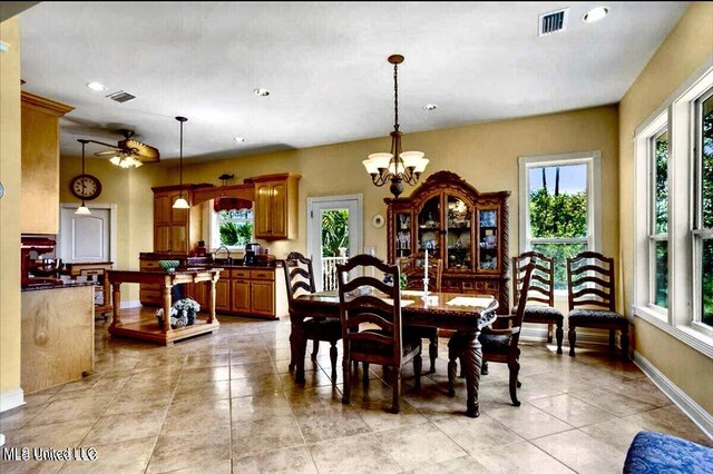 6301 Mary Mahoney Dr, Ocean Springs, MS 39564 - dining room featuring light tile patterned flooring, recessed lighting, a chandelier, baseboards, and ceiling fan