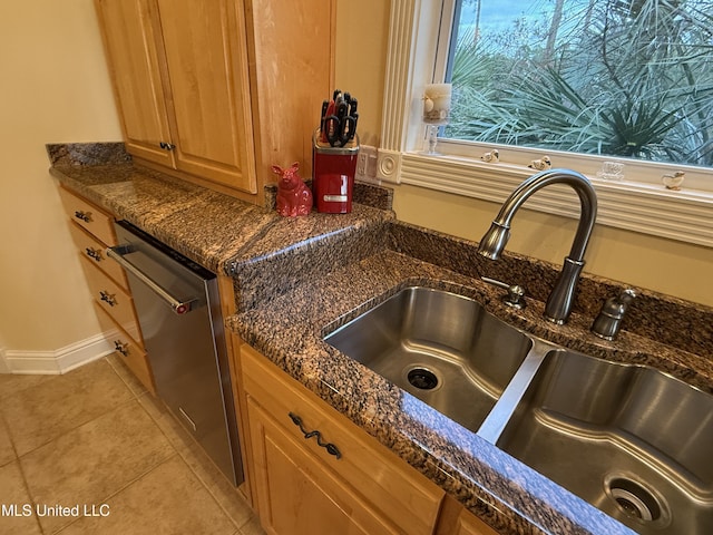 6301 Mary Mahoney Dr, Ocean Springs, MS 39564 - kitchen view of a sink, dishwasher, dark stone counters, and baseboards