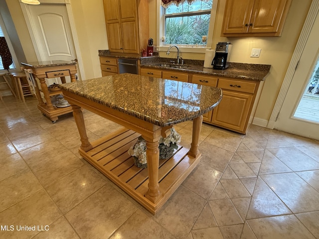 6301 Mary Mahoney Dr, Ocean Springs, MS 39564 - kitchen featuring a sink, dishwasher, and dark stone countertops