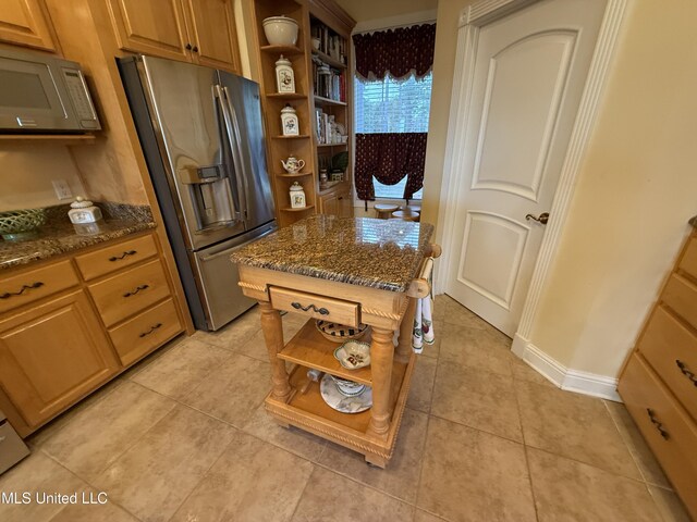 6301 Mary Mahoney Dr, Ocean Springs, MS 39564 - kitchen featuring open shelves, stainless steel refrigerator with ice dispenser, white microwave, and dark stone countertops