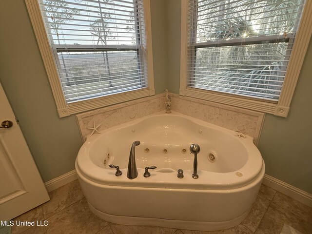 6301 Mary Mahoney Dr, Ocean Springs, MS 39564 - full bathroom with a tub with jets, baseboards, and tile patterned flooring