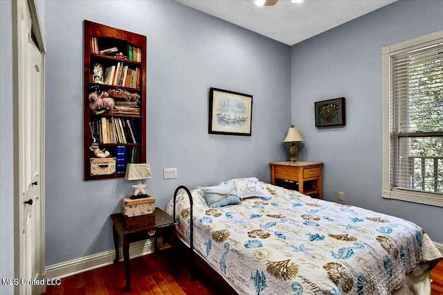 6301 Mary Mahoney Dr, Ocean Springs, MS 39564 - bedroom with dark wood-type flooring and baseboards