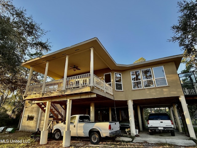 6301 Mary Mahoney Dr, Ocean Springs, MS 39564 - view of front of house with a carport, ceiling fan, and stairs