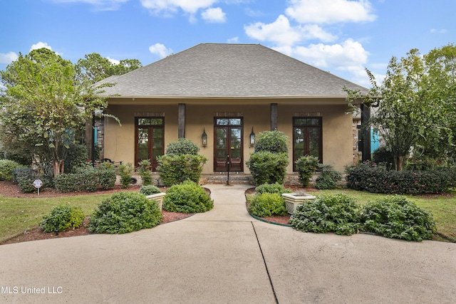 1 Eastbrooke Cir, Madison, MS 39110 - view of front of property featuring french doors, a shingled roof, and stucco siding
