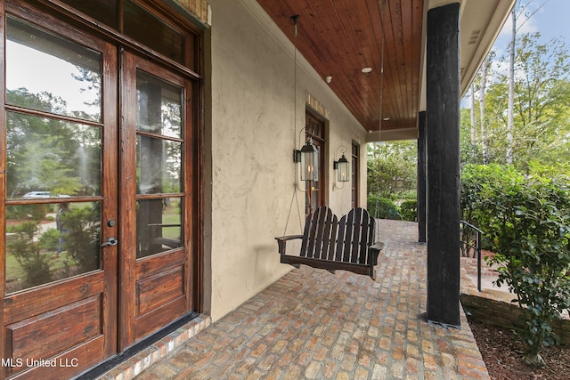 exterior space featuring french doors and a porch