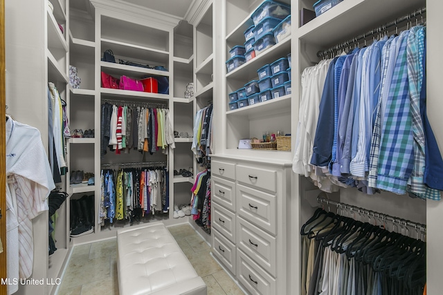 spacious closet featuring light tile patterned flooring