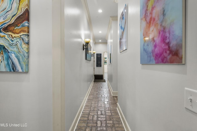 hallway featuring ornamental molding