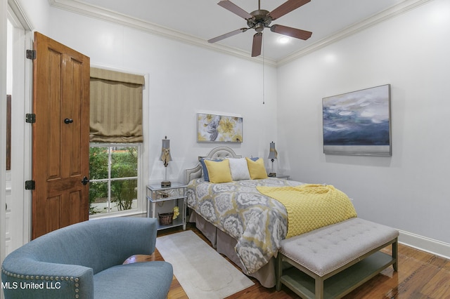 bedroom with ceiling fan, crown molding, and hardwood / wood-style flooring