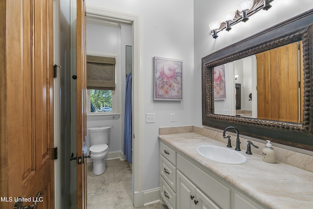 bathroom with vanity and toilet