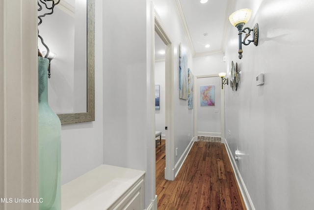 corridor featuring crown molding and hardwood / wood-style flooring