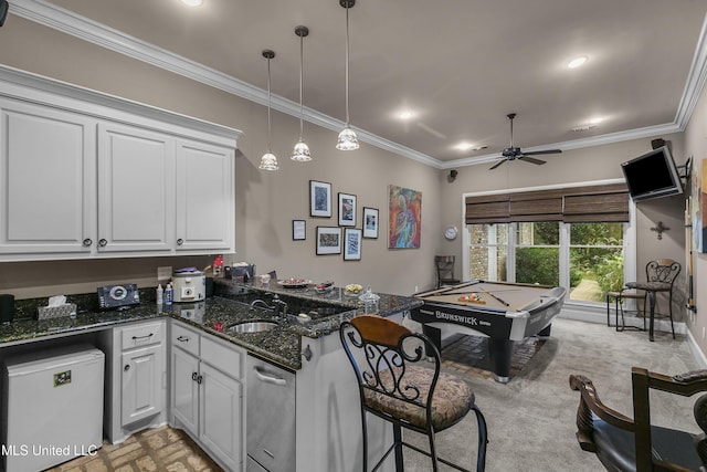 kitchen with billiards, ceiling fan, crown molding, dark stone countertops, and white cabinets