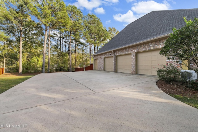 view of side of property featuring a garage