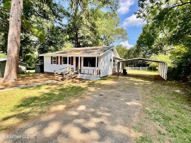 view of front of property with a carport