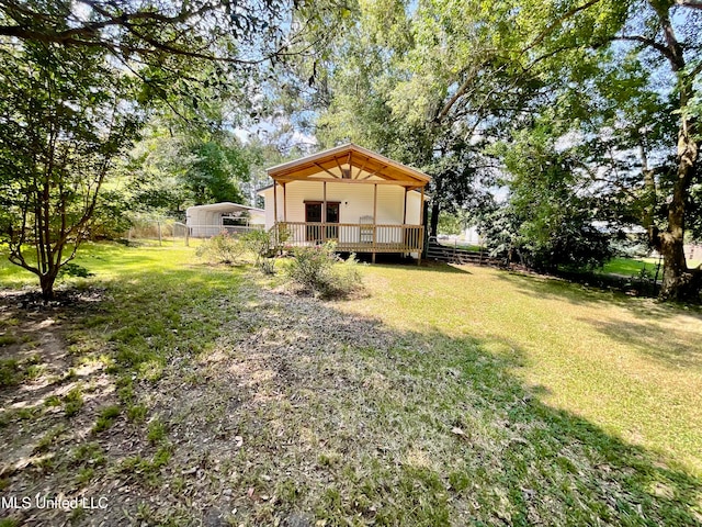 view of yard featuring a wooden deck