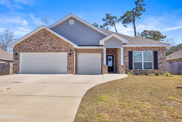 view of front of property featuring a garage, driveway, brick siding, and fence