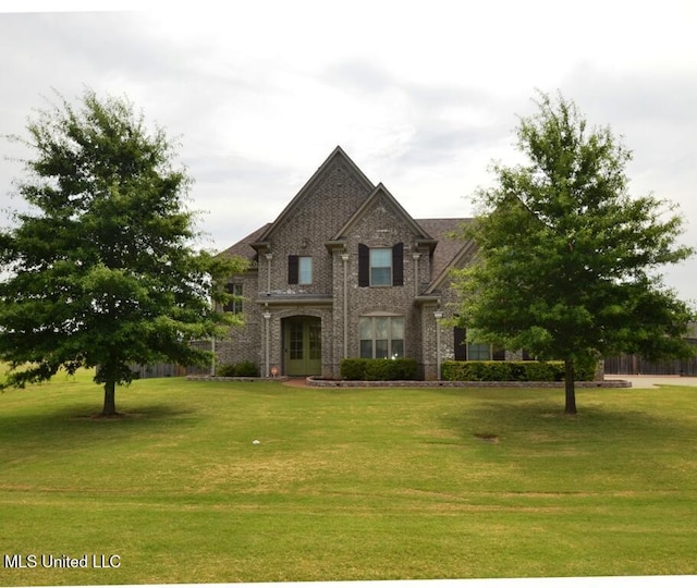 8146 Wisteria Dr, Olive Branch, MS 38654 - view of front facade featuring a front lawn and brick siding