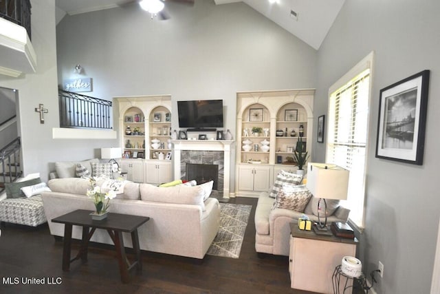 8146 Wisteria Dr, Olive Branch, MS 38654 - living area with high vaulted ceiling, a high end fireplace, ceiling fan, and wood finished floors
