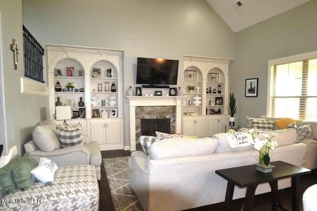 8146 Wisteria Dr, Olive Branch, MS 38654 - living room with high vaulted ceiling, a high end fireplace, and dark wood-style floors