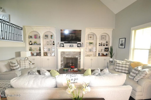 8146 Wisteria Dr, Olive Branch, MS 38654 - living room featuring high vaulted ceiling and a premium fireplace