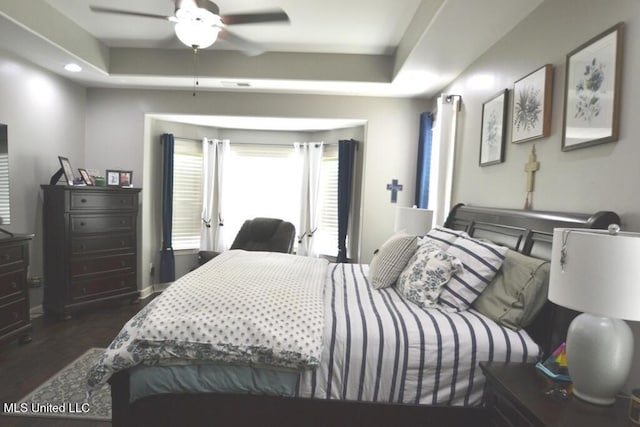 8146 Wisteria Dr, Olive Branch, MS 38654 - bedroom featuring dark wood-style flooring, a raised ceiling, and recessed lighting