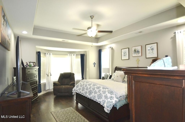 8146 Wisteria Dr, Olive Branch, MS 38654 - bedroom featuring dark wood-style flooring, recessed lighting, a tray ceiling, and ceiling fan
