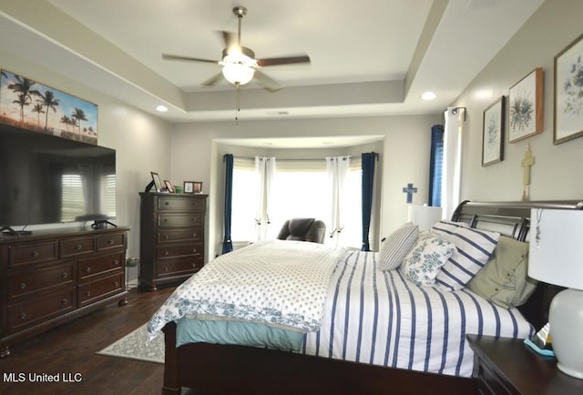8146 Wisteria Dr, Olive Branch, MS 38654 - bedroom with dark wood finished floors, a raised ceiling, recessed lighting, and a ceiling fan