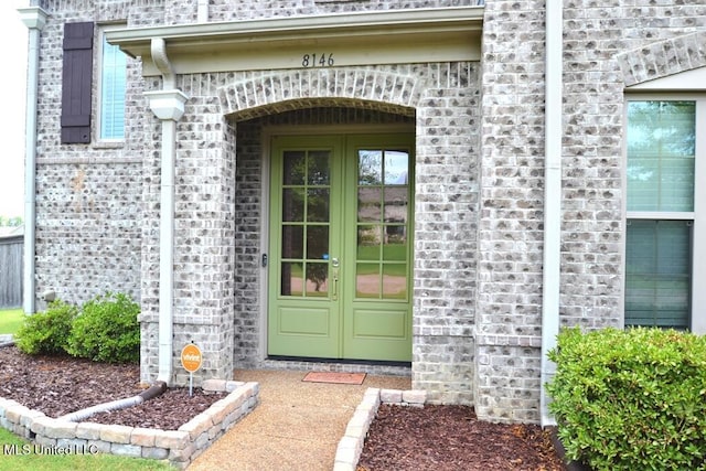 8146 Wisteria Dr, Olive Branch, MS 38654 - entrance to property with french doors and brick siding