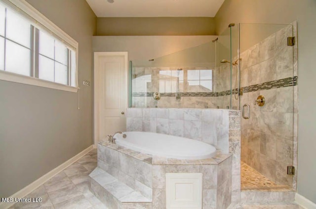 8146 Wisteria Dr, Olive Branch, MS 38654 - bathroom featuring a garden tub, a shower stall, and healthy amount of natural light