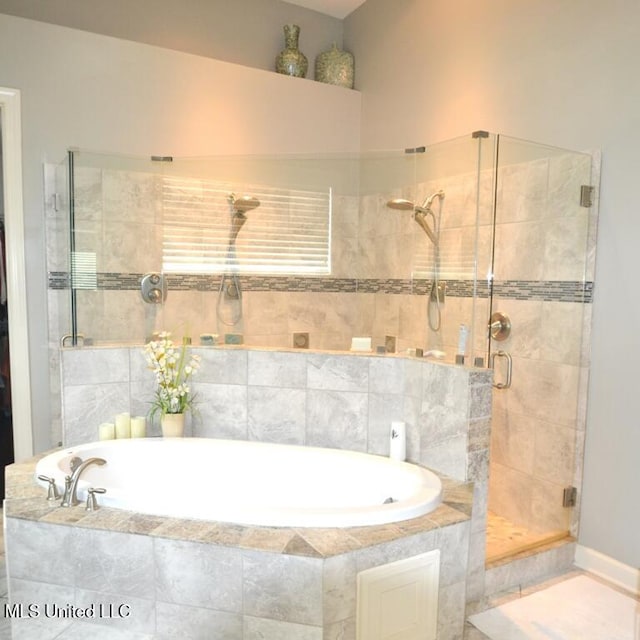 8146 Wisteria Dr, Olive Branch, MS 38654 - full bathroom featuring a shower stall and a bath