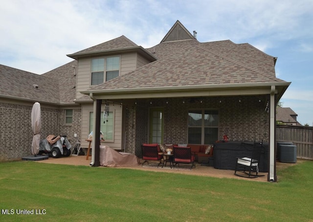 8146 Wisteria Dr, Olive Branch, MS 38654 - rear view of property with an outdoor hangout area, a patio area, a shingled roof, and brick siding