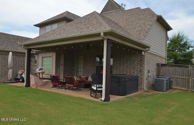 8146 Wisteria Dr, Olive Branch, MS 38654 - rear view of house featuring brick siding, an outdoor living space, a patio, and a shingled roof