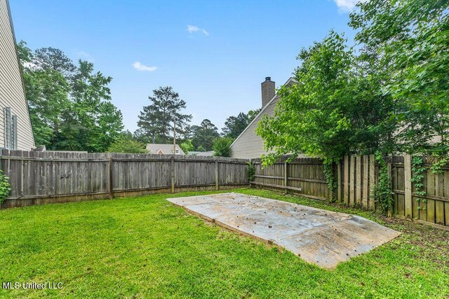 view of yard with a fenced backyard