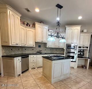 3808 Acadian Village Dr, Ocean Springs, MS 39564 - kitchen with appliances with stainless steel finishes, light tile patterned floors, backsplash, dark countertops, and ornamental molding